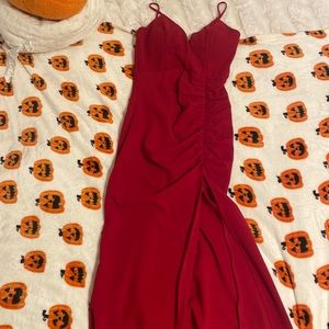 Long prom/homecoming dress with a slit for left leg. Has cups in it